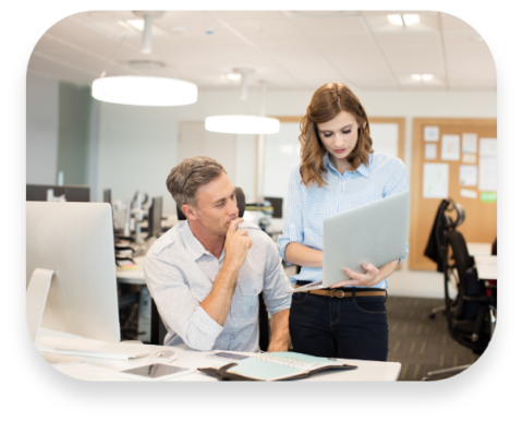 business-colleagues-working-together-on-laptop-at–MF3B25U ServiceNow Custom Applications